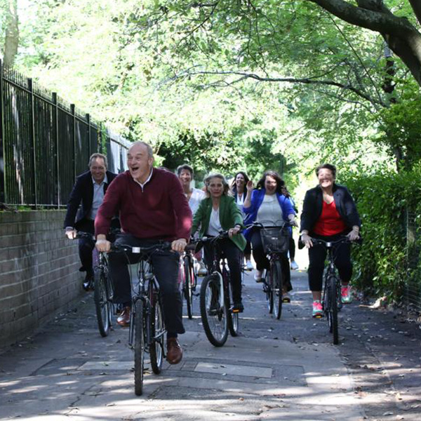 Ed Davey arrives at Conference on a bike with MPs and PPCs