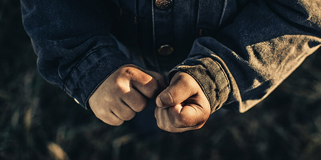 Clenched fists held together.