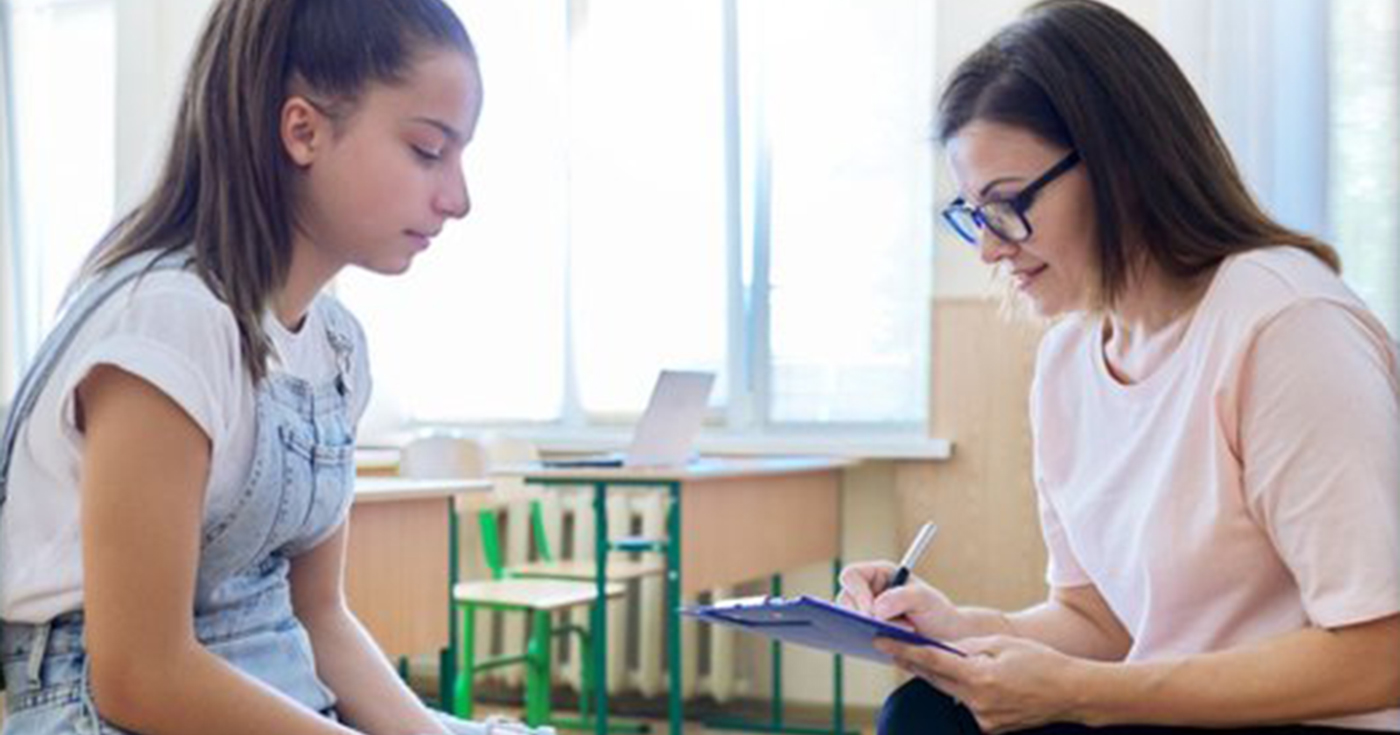 A child speaks to a mental health practitioner.