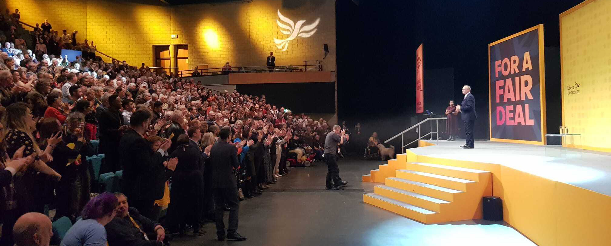 The conference hall giving Ed Davey a standing ovation as he finishes his speech
