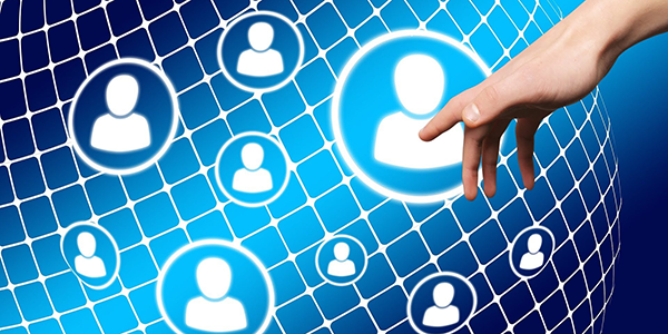 A hand reaching out to a network of data