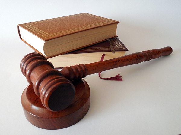A gavel with two books