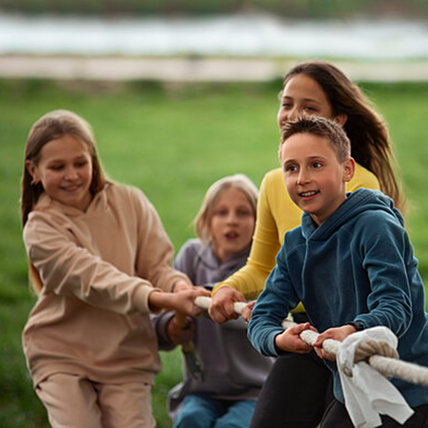 Children playing a tug of war.