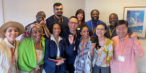 A group of members take a photo together at an ALDC event
