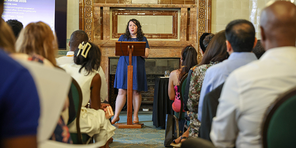 Victoria Collins MP addresses a group of people in a talk at the National Liberal Club