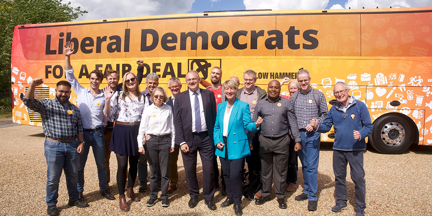 Ed Davey with Lib Dem activists in front of Yellow Hammer 1.