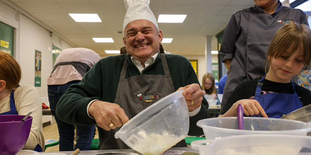 Ed baking with children.