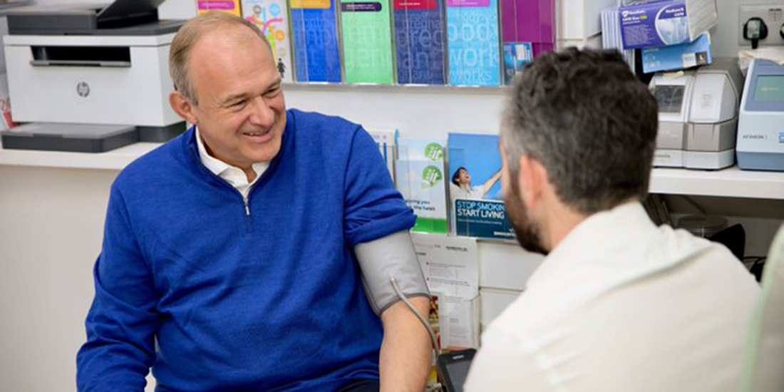 Ed Davey having his blood pressure checked.