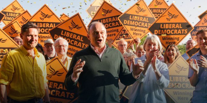 Ed Davey MP and other Lib Dem figures at a Lib Dem rally.