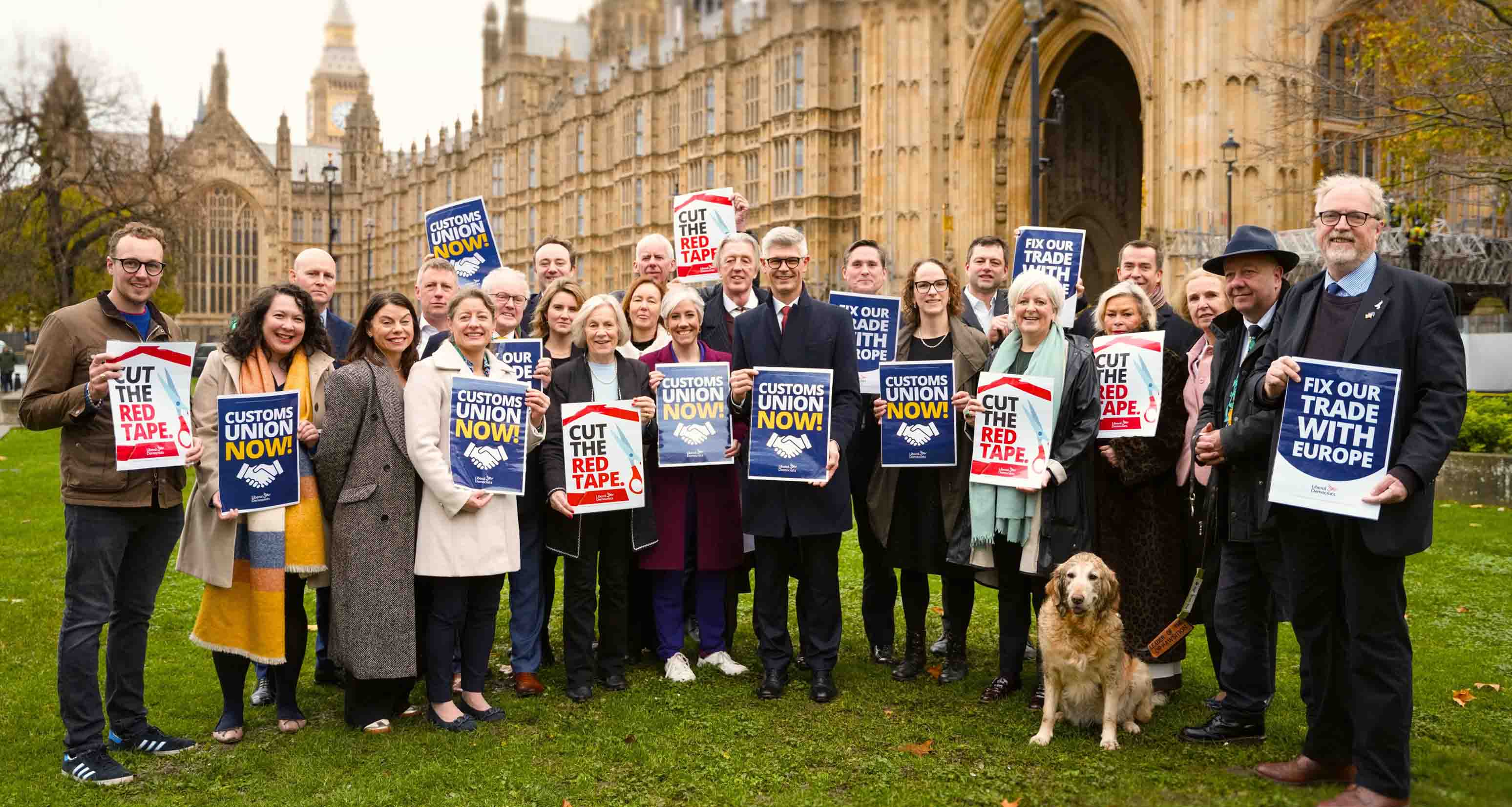 Lib Dems MPs outside Parliament holding posters supporting our Customs Union campaign