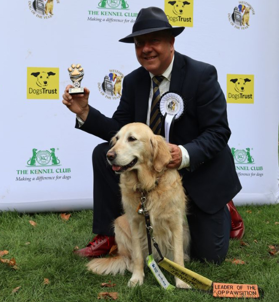 Jennie receiving her trophy alongside Steve Darling MP.