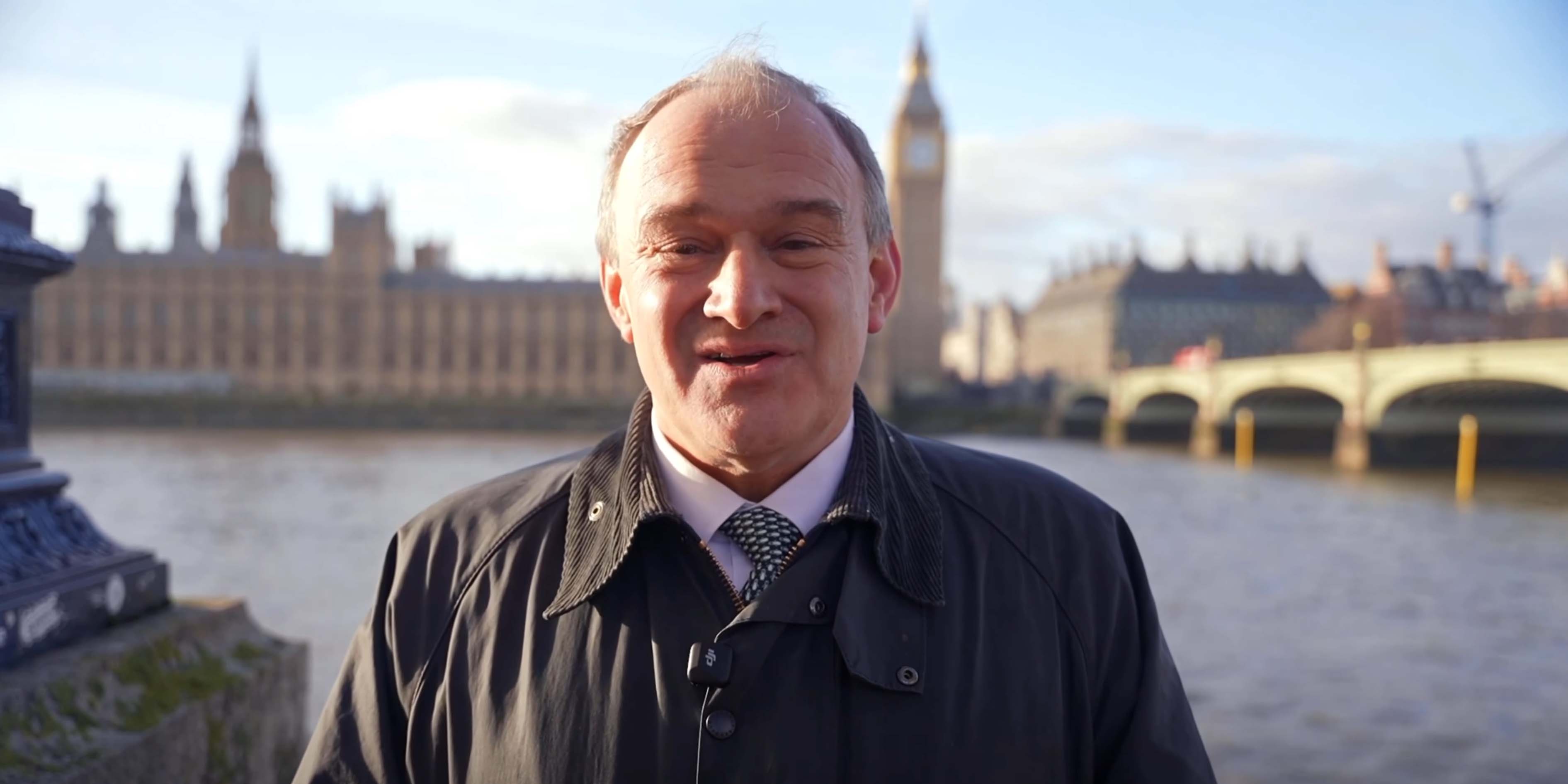 Ed Davey speaking in front of the House of Parliament for the Liberal Democrats' PPB.